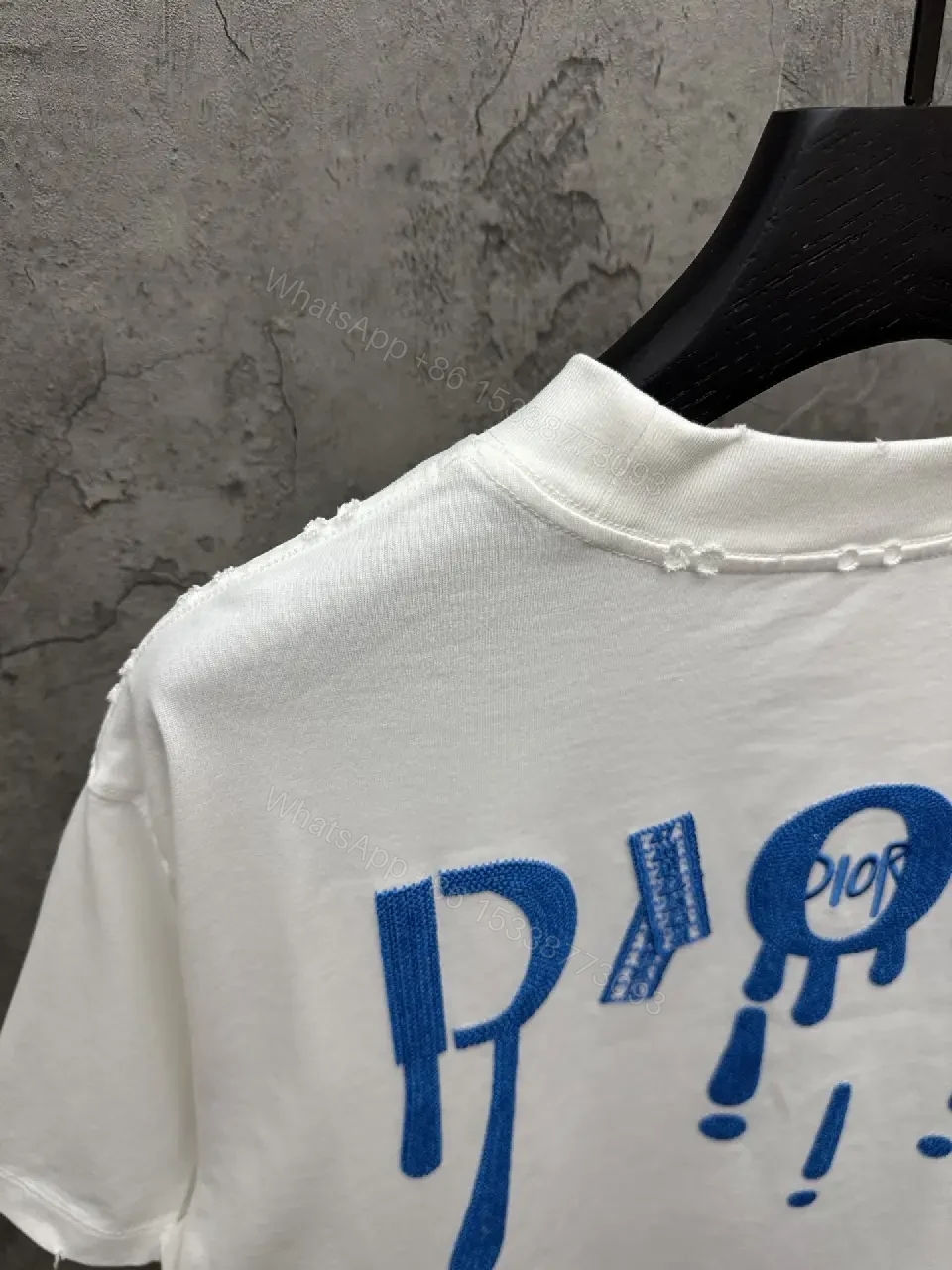 View 11 of Minimalist White Tee with Blue Embroidered Logo, Premium Cotton