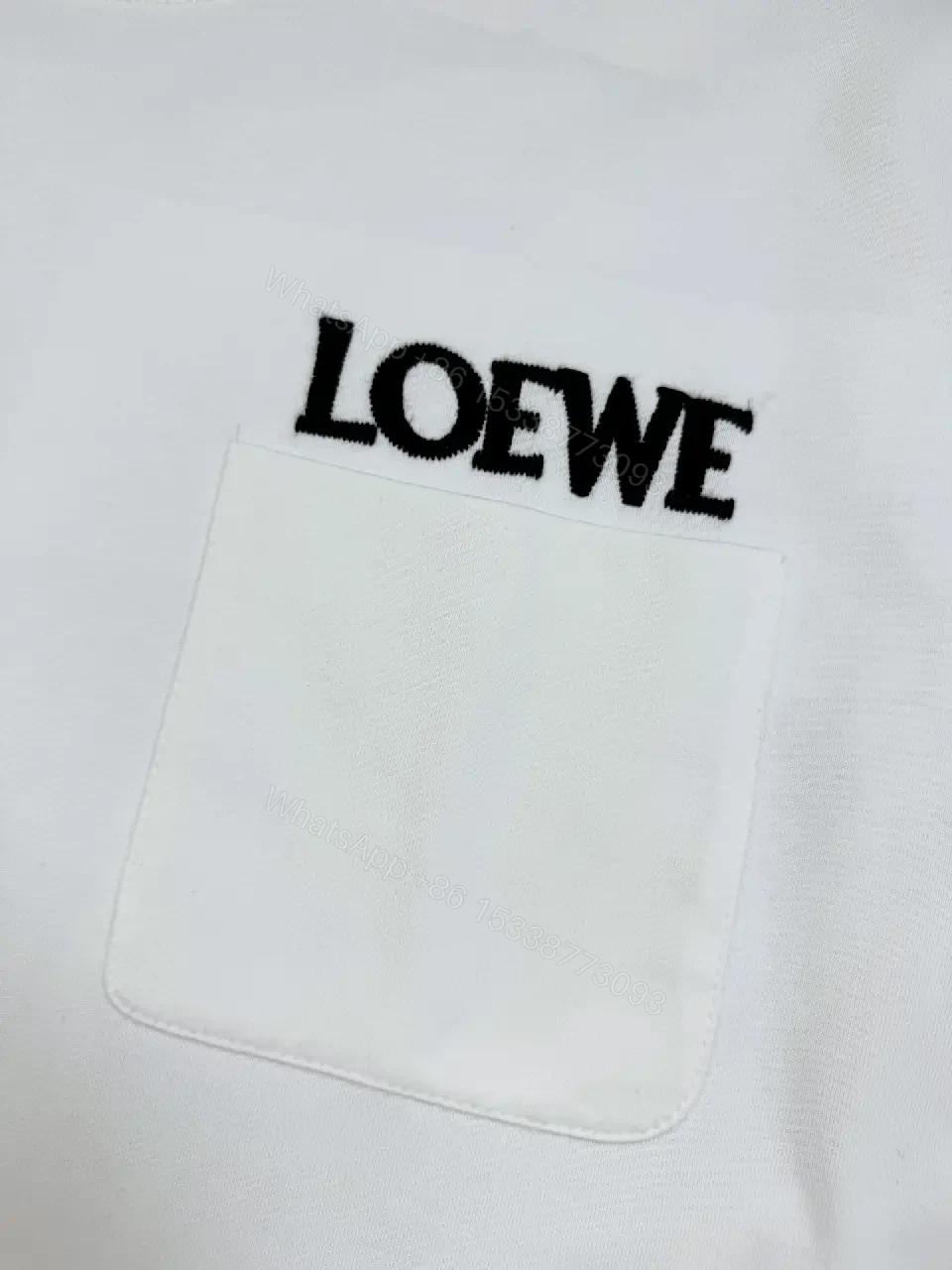 View 4 of Minimalist White Cotton Tee with Bold Pocket, Everyday Luxury Top