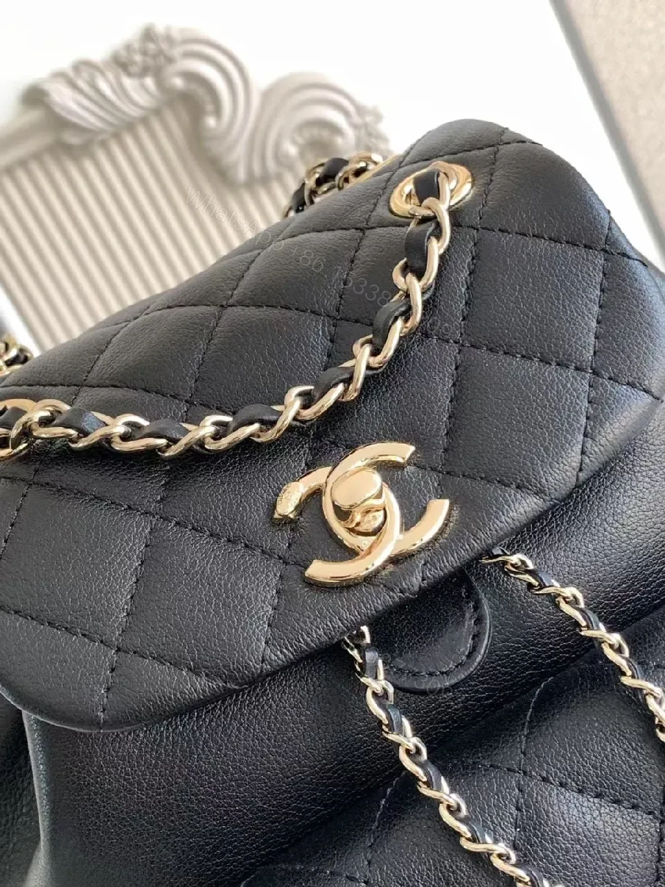 View 2 of Quilted Black Backpack with Gold Hardware Luxury Mini Bag