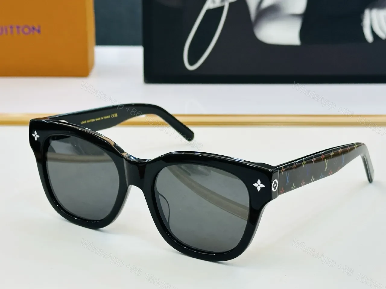 Bold Black Frame Sunglasses with Luxe Monogram Detailing — view 1