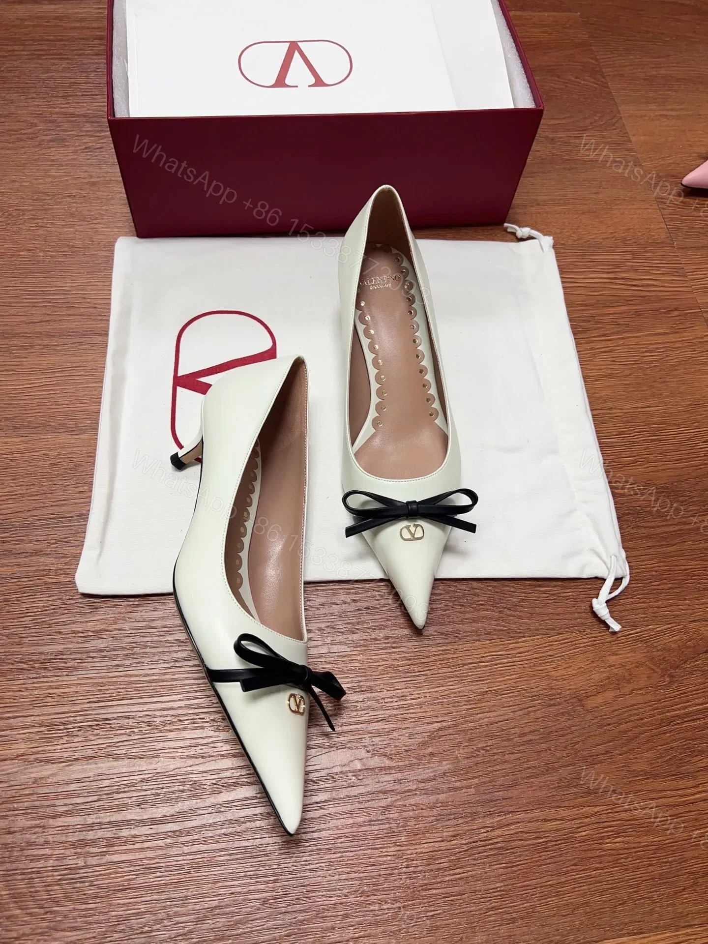 View 4 of Valentino Women Ivory Leather Bow Accent Pumps