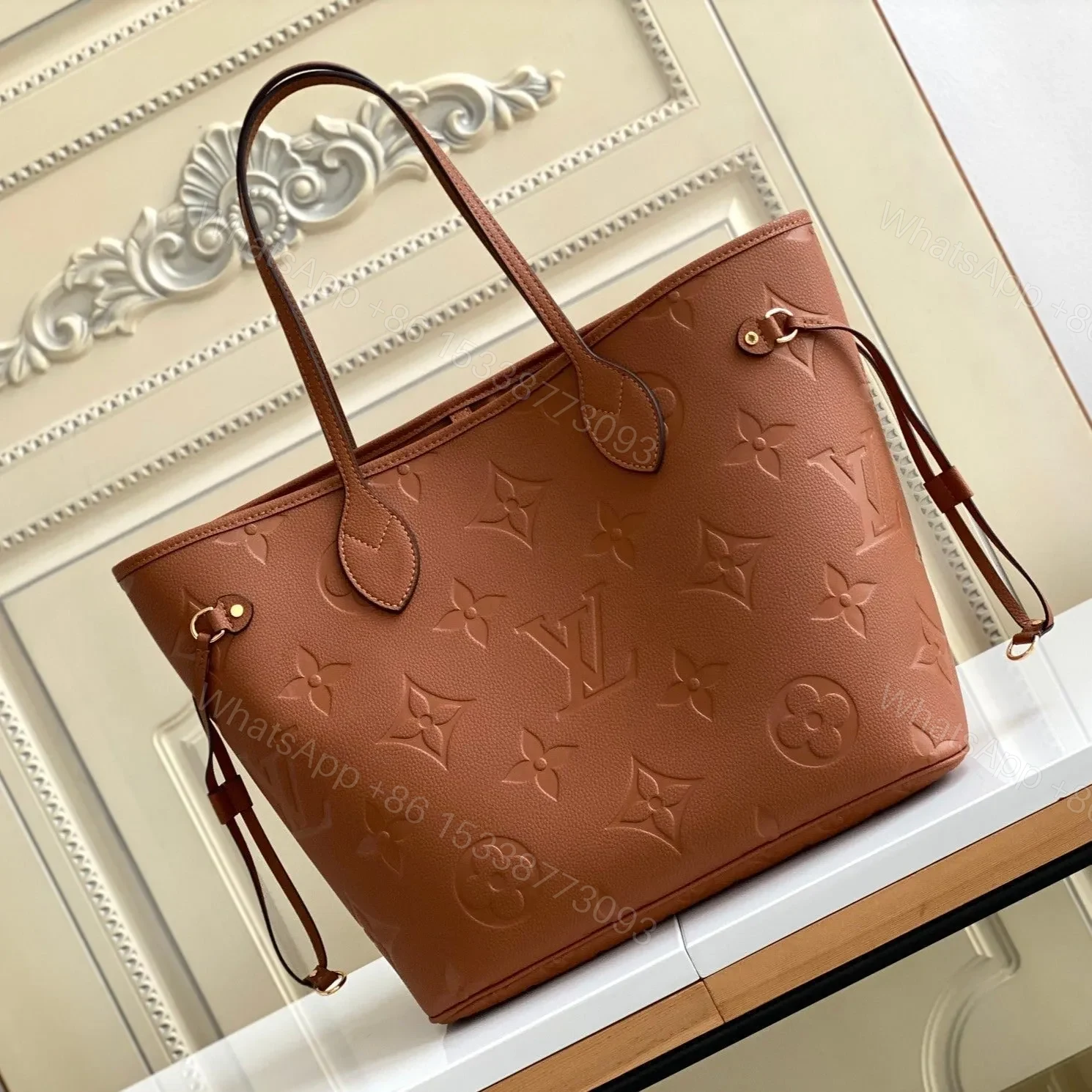 LV NEVERFULL MM 32 BROWN MONOGRAM EMPREINTE LEATHER — view 1