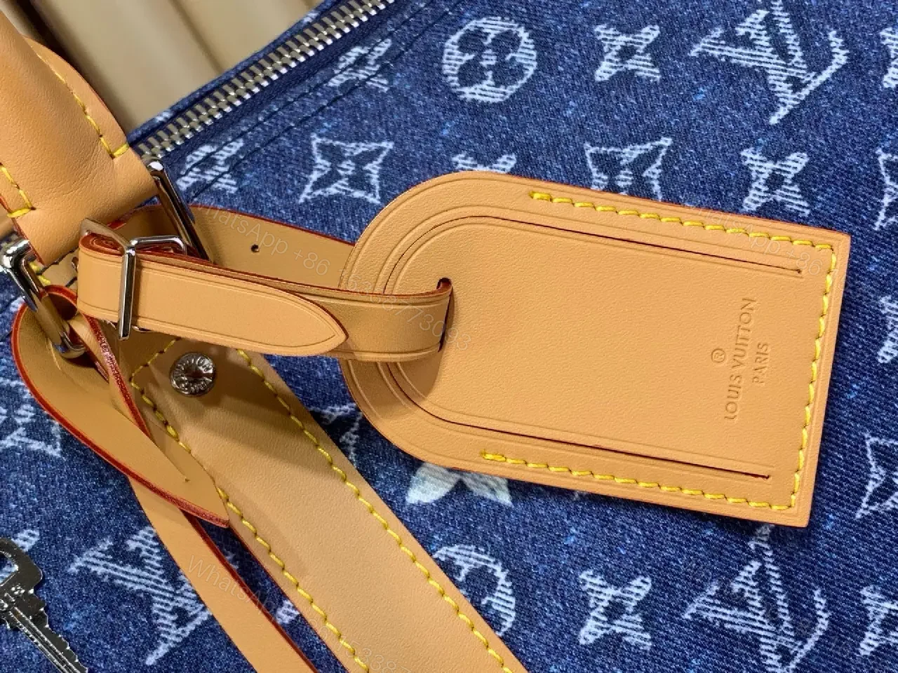 View 8 of Blue denim monogram-print travel bag with tan leather trim for luxury weekends