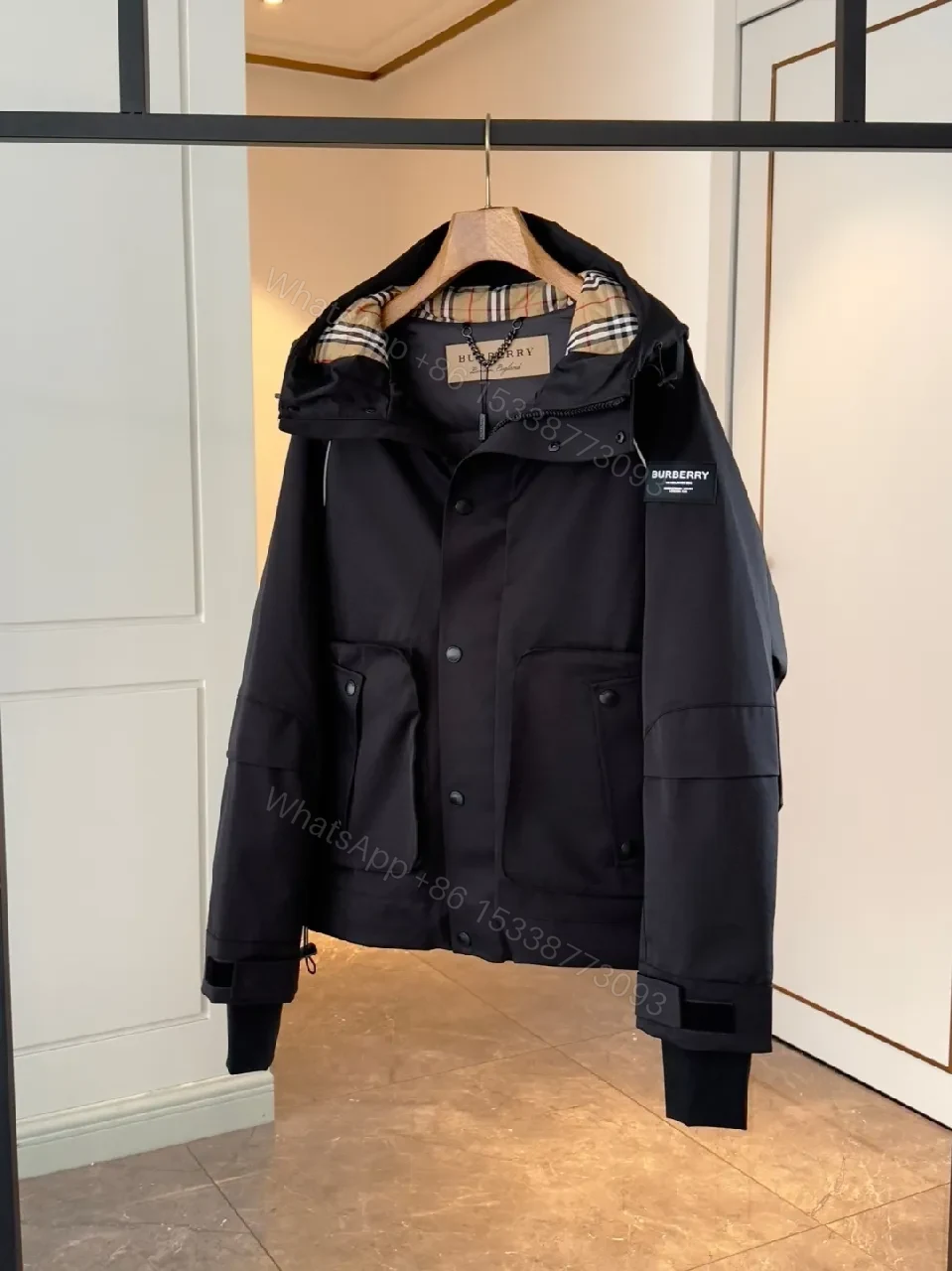 View 2 of Water-Resistant Black Parka with Plaid Lining Luxury-Utility Coat