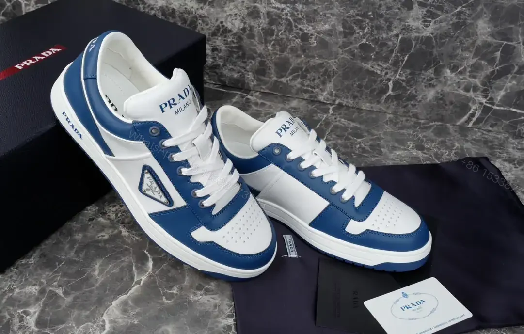 View 2 of PRADA DOWNTOWN LEATHER SNEAKERS IN WHITE AND LACQUER BLUE- PRD011
