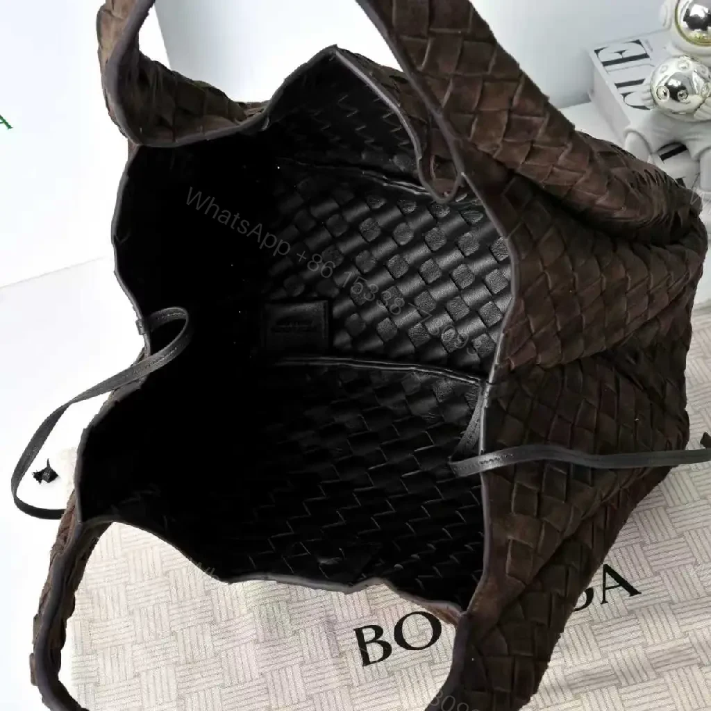 View 3 of brown woven leather hobo bag with intrecciato texture for everyday luxury