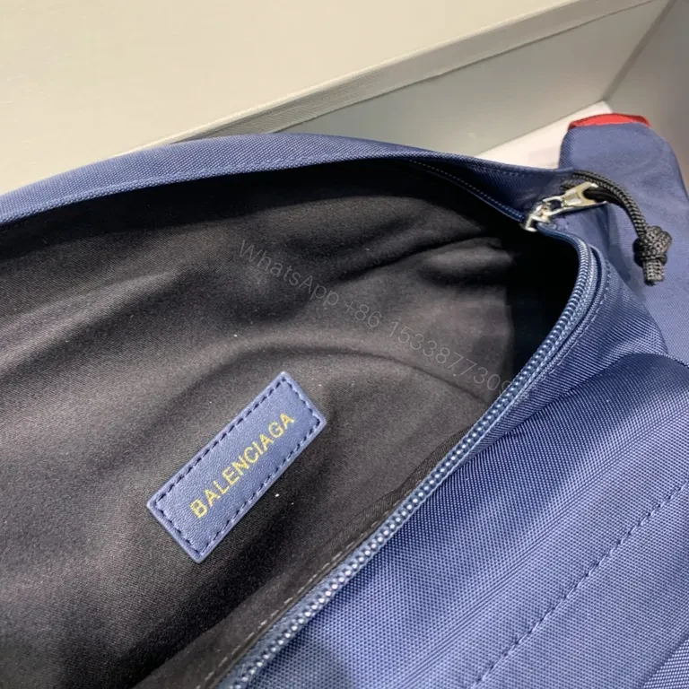 View 8 of Bold Navy Balenciaga Belt Bag with Red Strap - Hands-Free Luxury