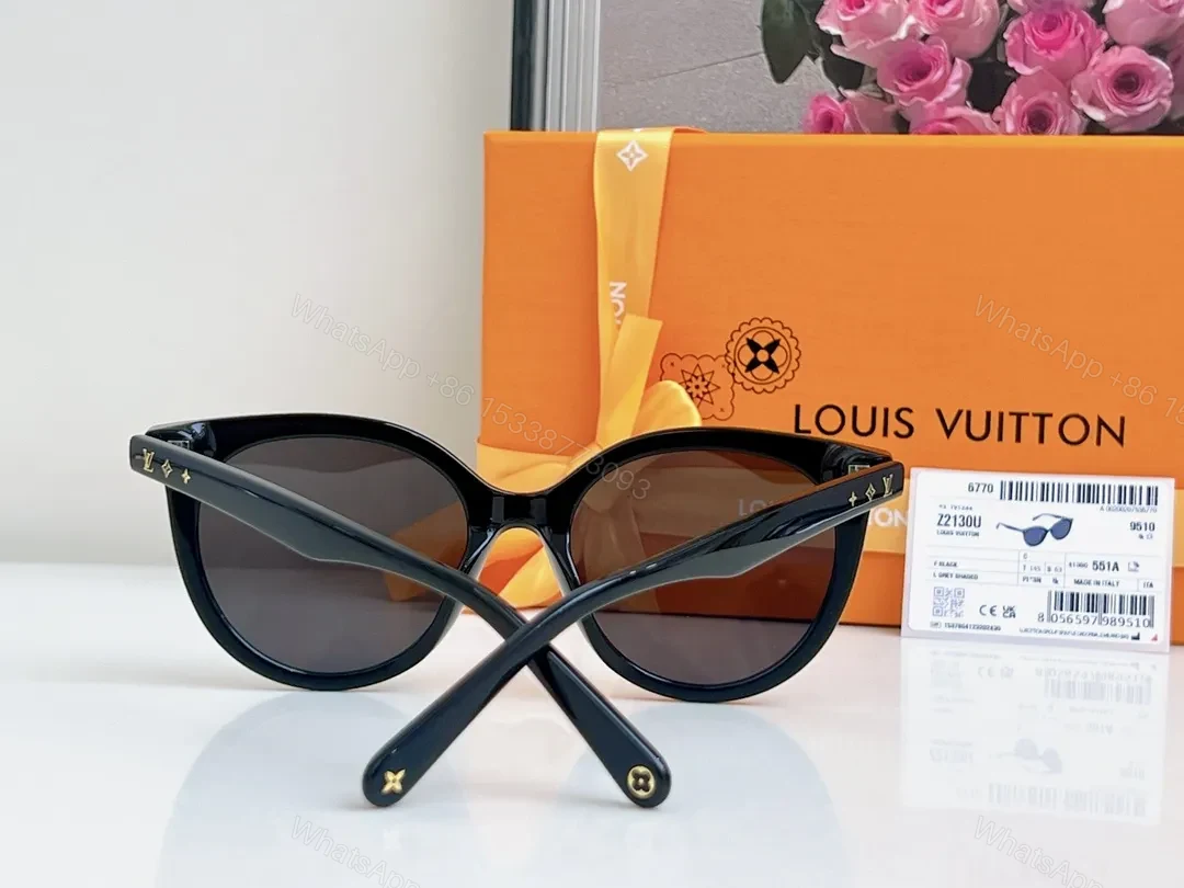 View 2 of Sleek Black Round-Frame Sunglasses with LV Accents