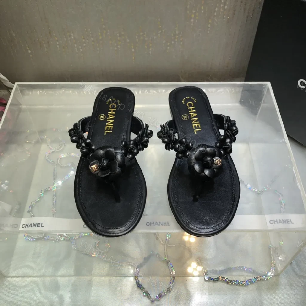 Black Leather-Feel Floral Slip-Ons with Luxe Accents — view 1