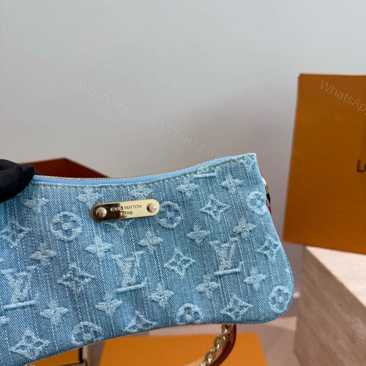 View 4 of Louis Vuitton Liv Pochette Blue Denim 25Cm M83532