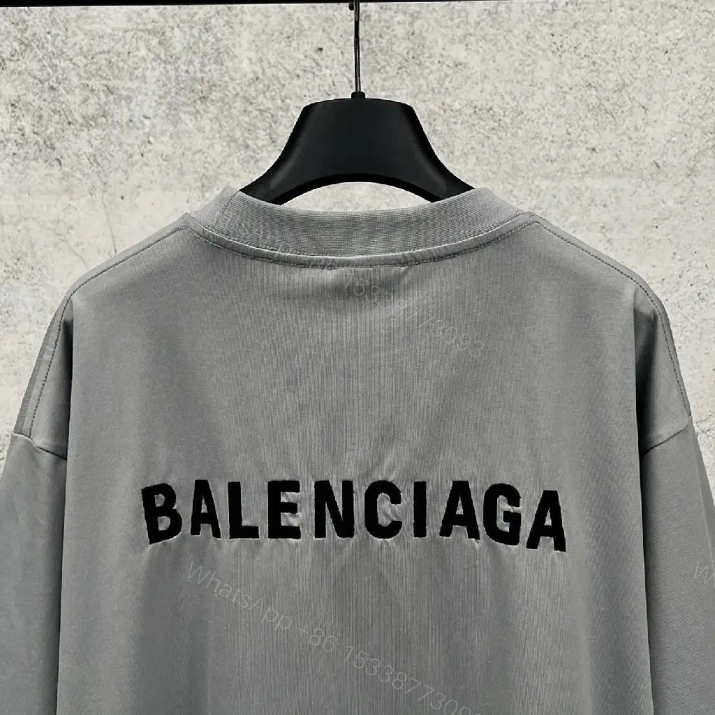 View 8 of Neutral Cotton Oversized Tee: Minimal Logo, Elevated Comfort