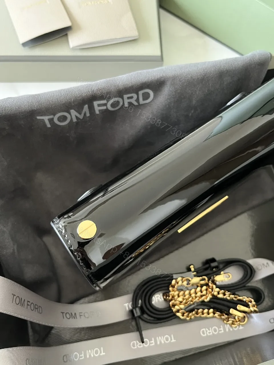 View 5 of Compact Black Leather Crossbody with Gold TF Emblem