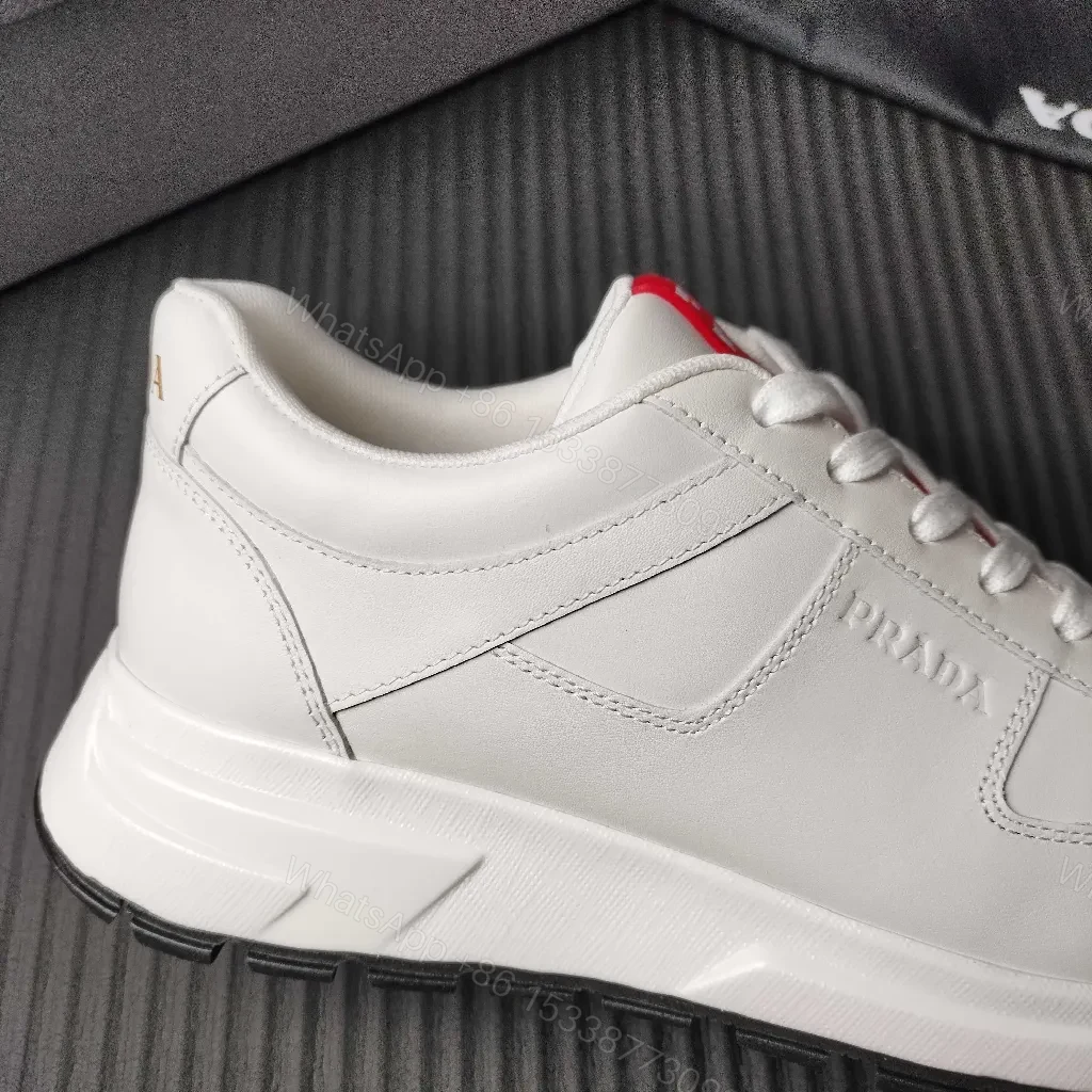 View 7 of Minimalist White Leather Trainers with Red Accent - Modern Comfort Lux
