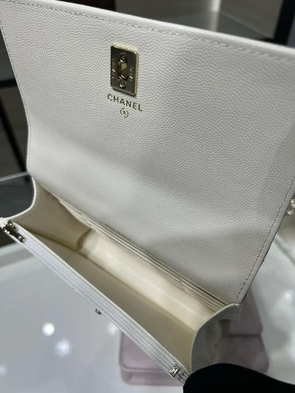 View 9 of White Quilted Mini Bag: Gold Logo, Structured Luxury, Compact