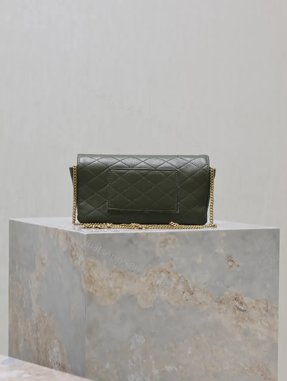 View 5 of Soft-Quilted Leather Clutch with Gold Emblem, Evening Style, Compact Luxury
