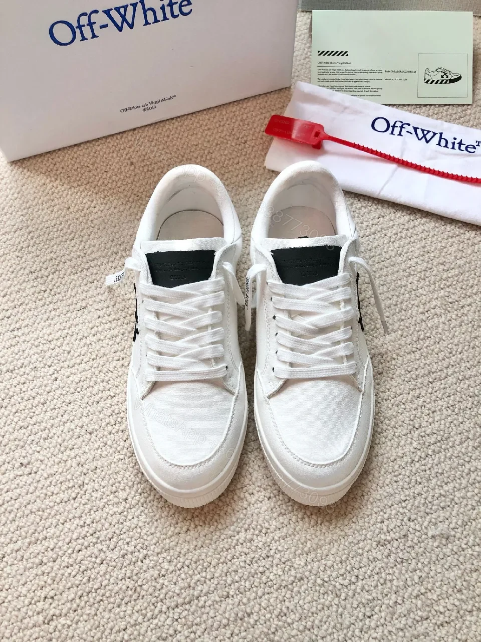 View 6 of Minimalist White Leather Low-Top Sneakers with Signature Detail