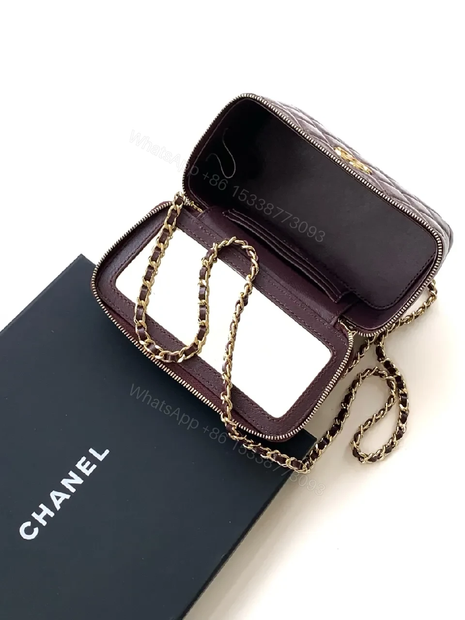 View 7 of Quilted Burgundy Bag with Gold Chain Handle—Compact Luxury