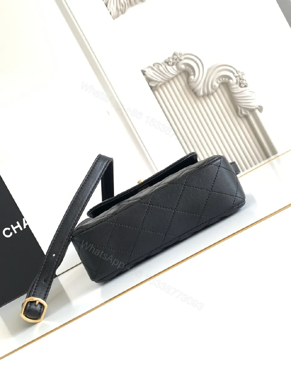 View 3 of Compact Black Quilted Bag with Gold Hardware