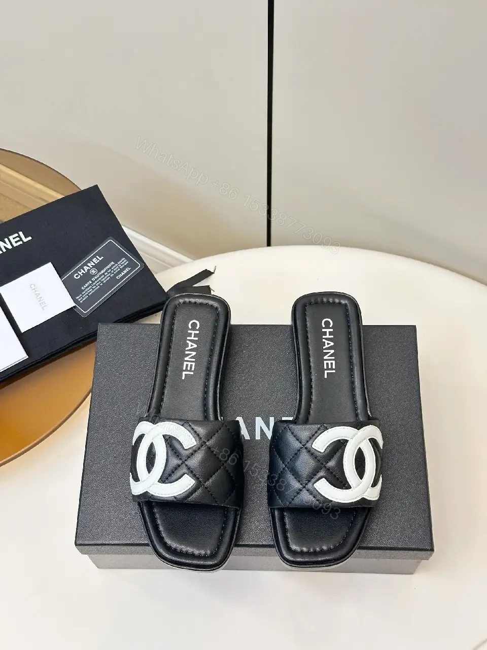 View 2 of Black Quilted Chanel Sliders with White Logo, Slide Sandals