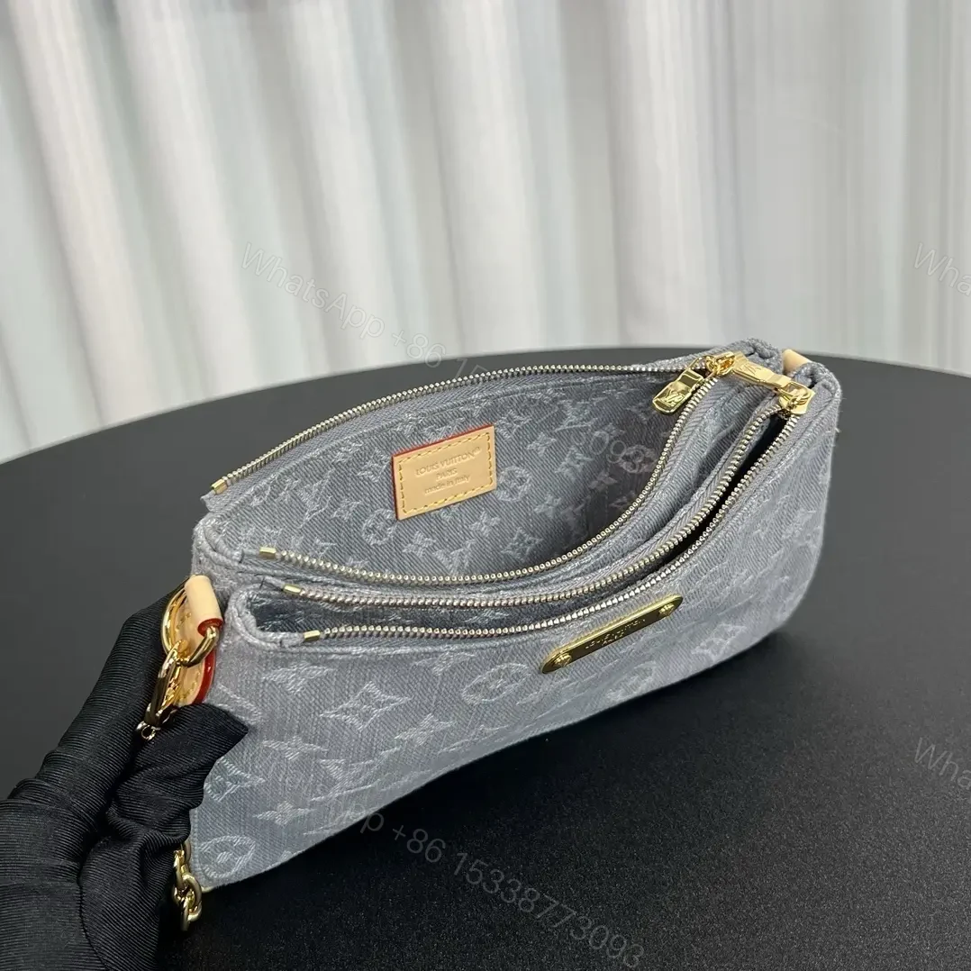 View 5 of Louis Vuitton Liv Pochette in Washed Denim