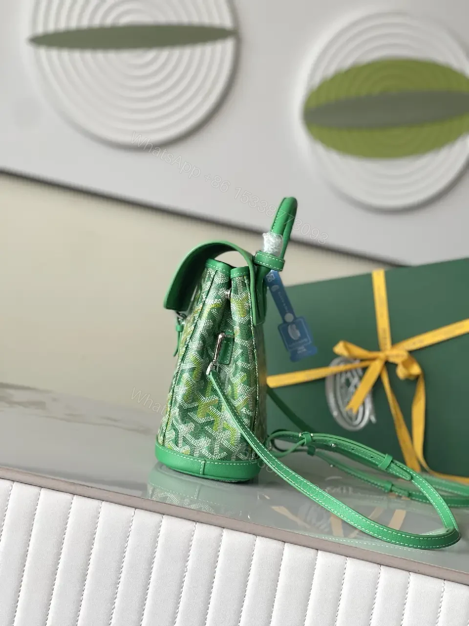 View 7 of green leather mini backpack with monogram pattern and luxury green trim for everyday use
