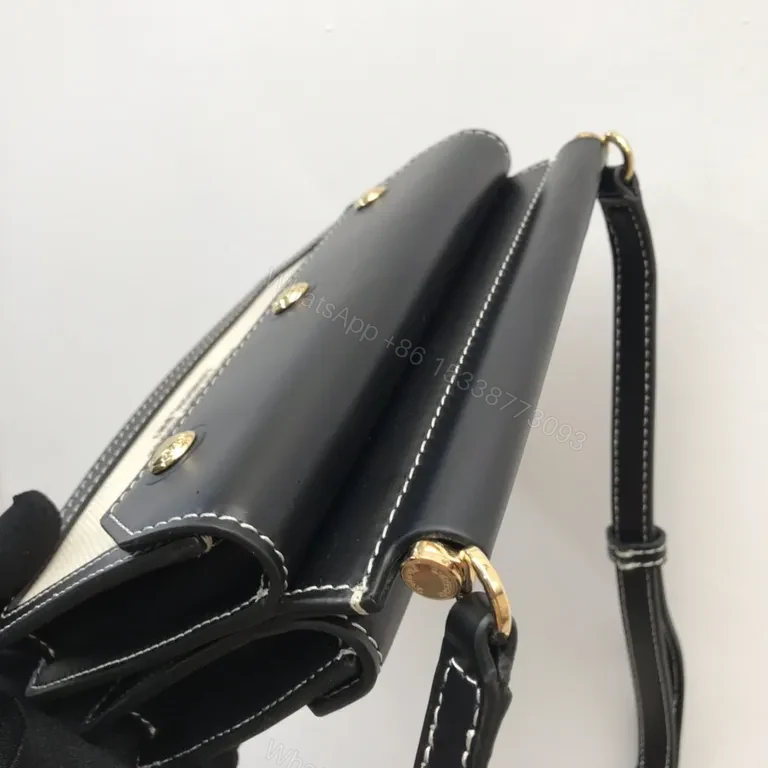 View 9 of Beige Canvas & Black Leather Crossbody: Bold Brand Duo