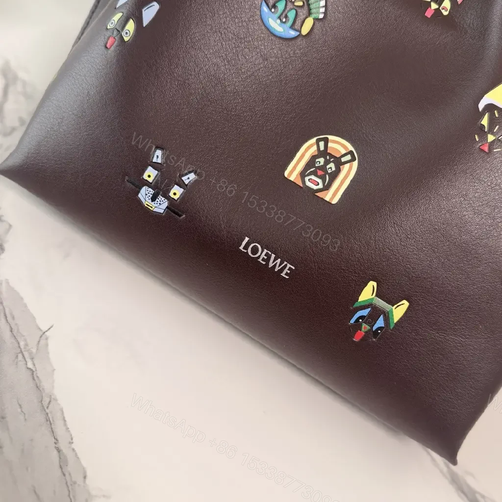 View 3 of Dark Leather Crossbody: Playful Animal Motifs, Compact Chic