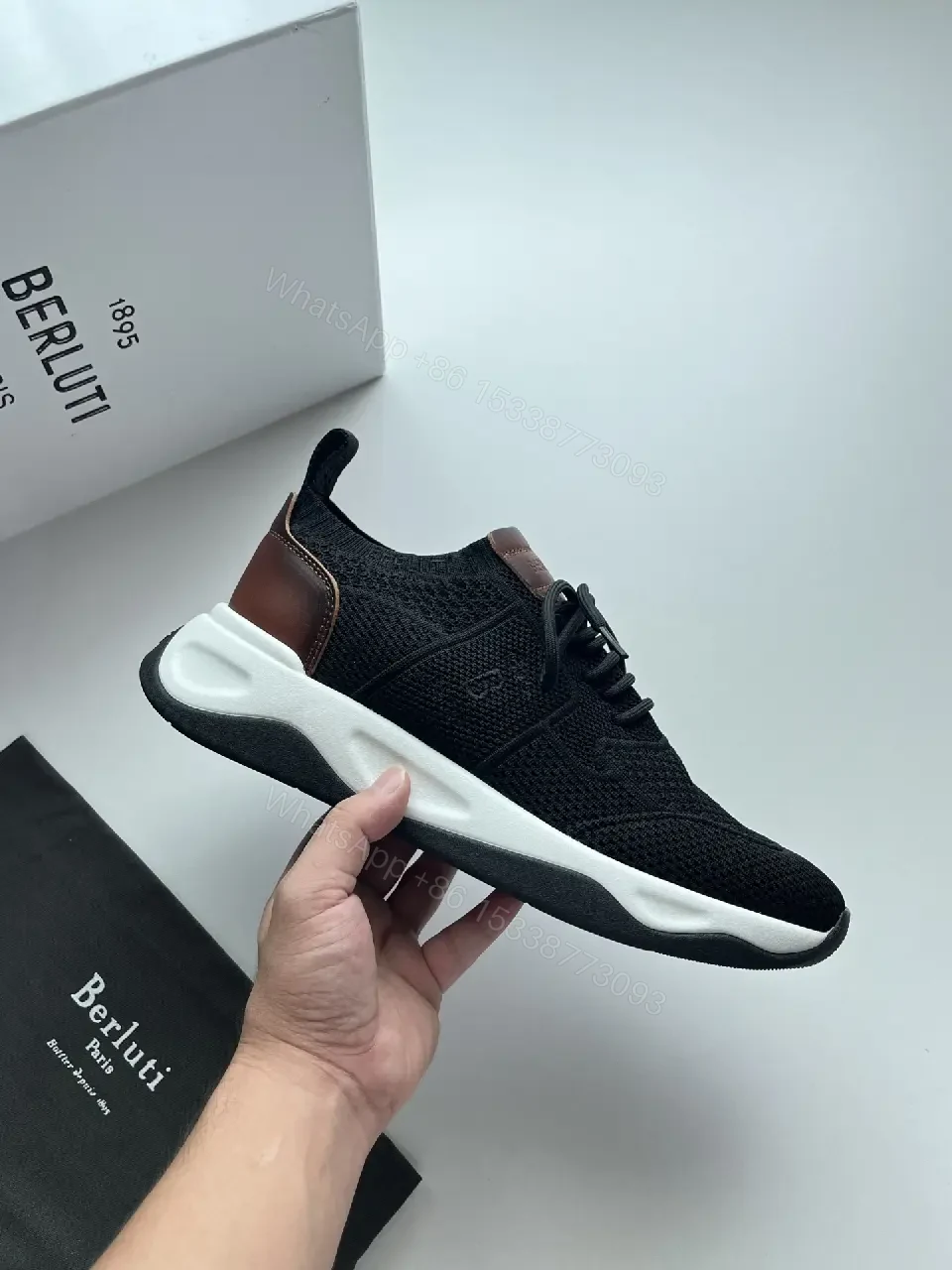 View 3 of Black knit sneakers with leather trim for everyday luxury and comfort