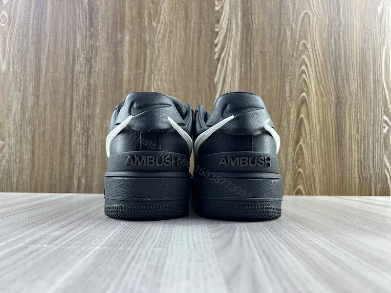 View 3 of Black Leather Low-Top Sneakers with White Swoosh - Luxury Streetwear