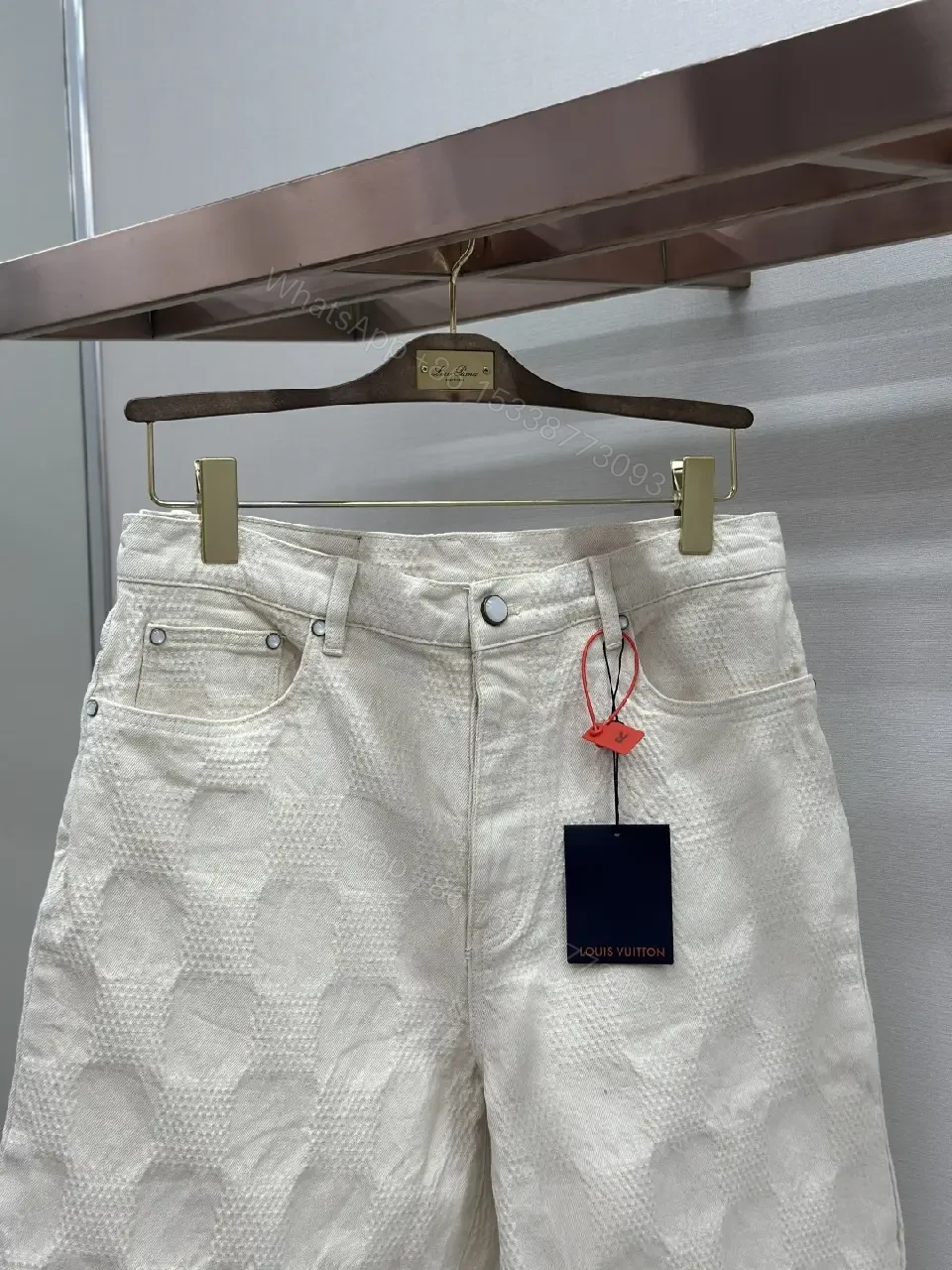 View 6 of Beige textured cotton-blend shorts with monogram-inspired print for everyday luxury