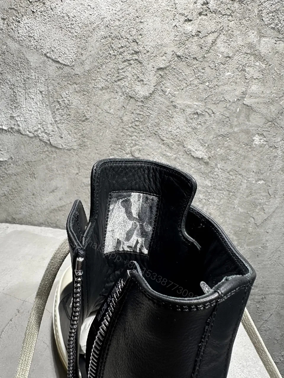 View 5 of Black Leather High-Top Sneakers with Off-White Accents