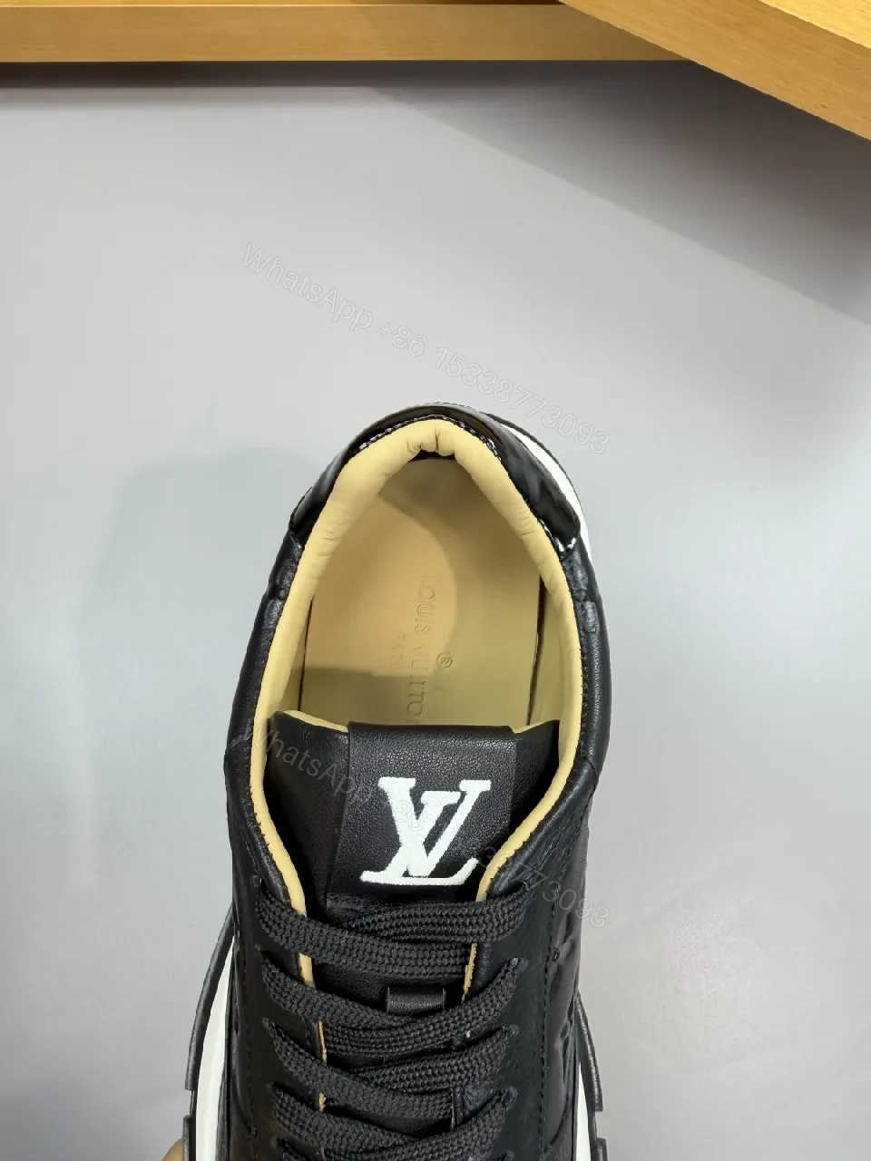 View 6 of Black Leather Trainer with Subtle Monogram Detailing - Everyday Luxe Comfort