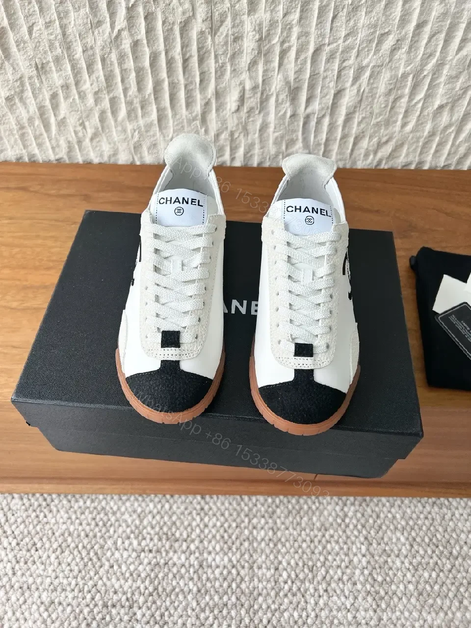 View 4 of Chic Monochrome Leather-Accent Luxury Sneaker, Low-Top