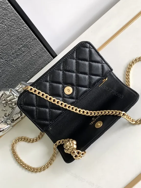 View 7 of Mini Quilted Black Chain Bag with Gold Logo â€” Luxury Silhouette