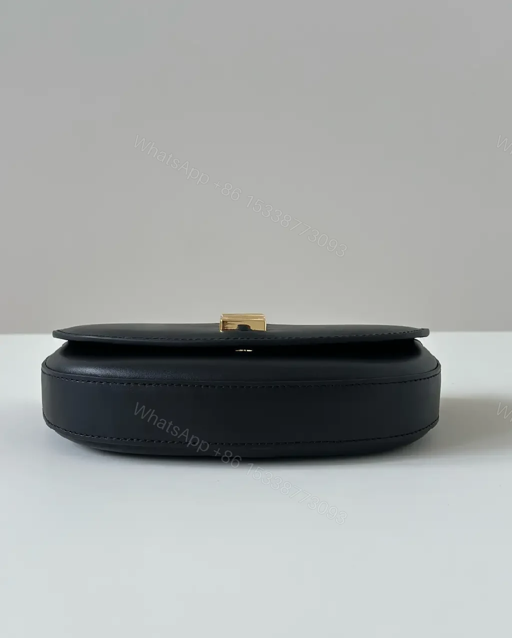 View 6 of Chic Black Leather Shoulder Bag with Gold Hardware, Compact Luxury