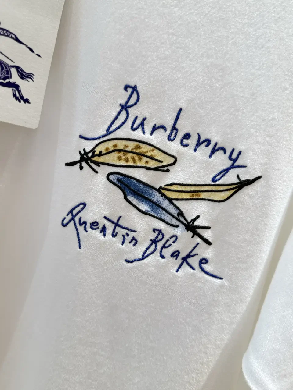 View 4 of White Cotton Oversized T-Shirt with Burberry Graphic Front