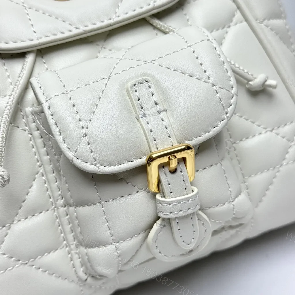 View 6 of Quilted White Mini Backpack with Gold Hardware - Compact Luxury