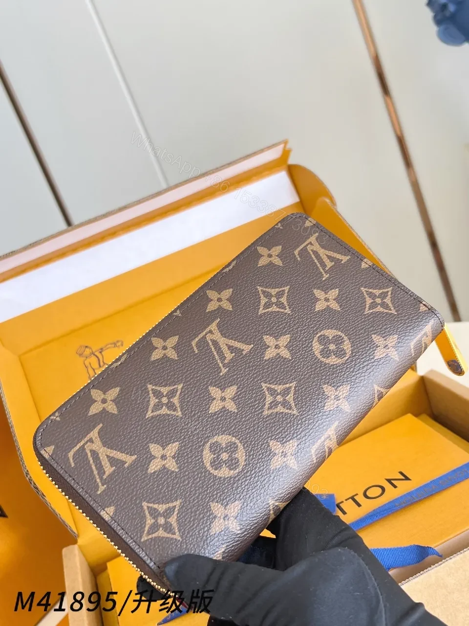 View 3 of Compact Monogram Leather Wallet: Signature Texture, Gold Zipper