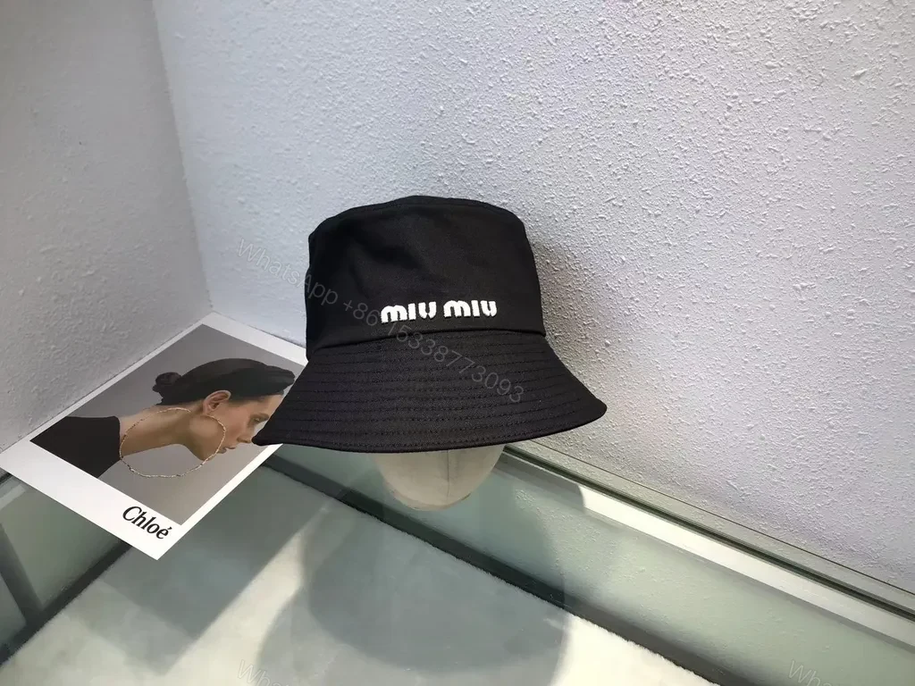 View 2 of Crisp White Miu Miu Bucket Hat: Iconic Logo Shield