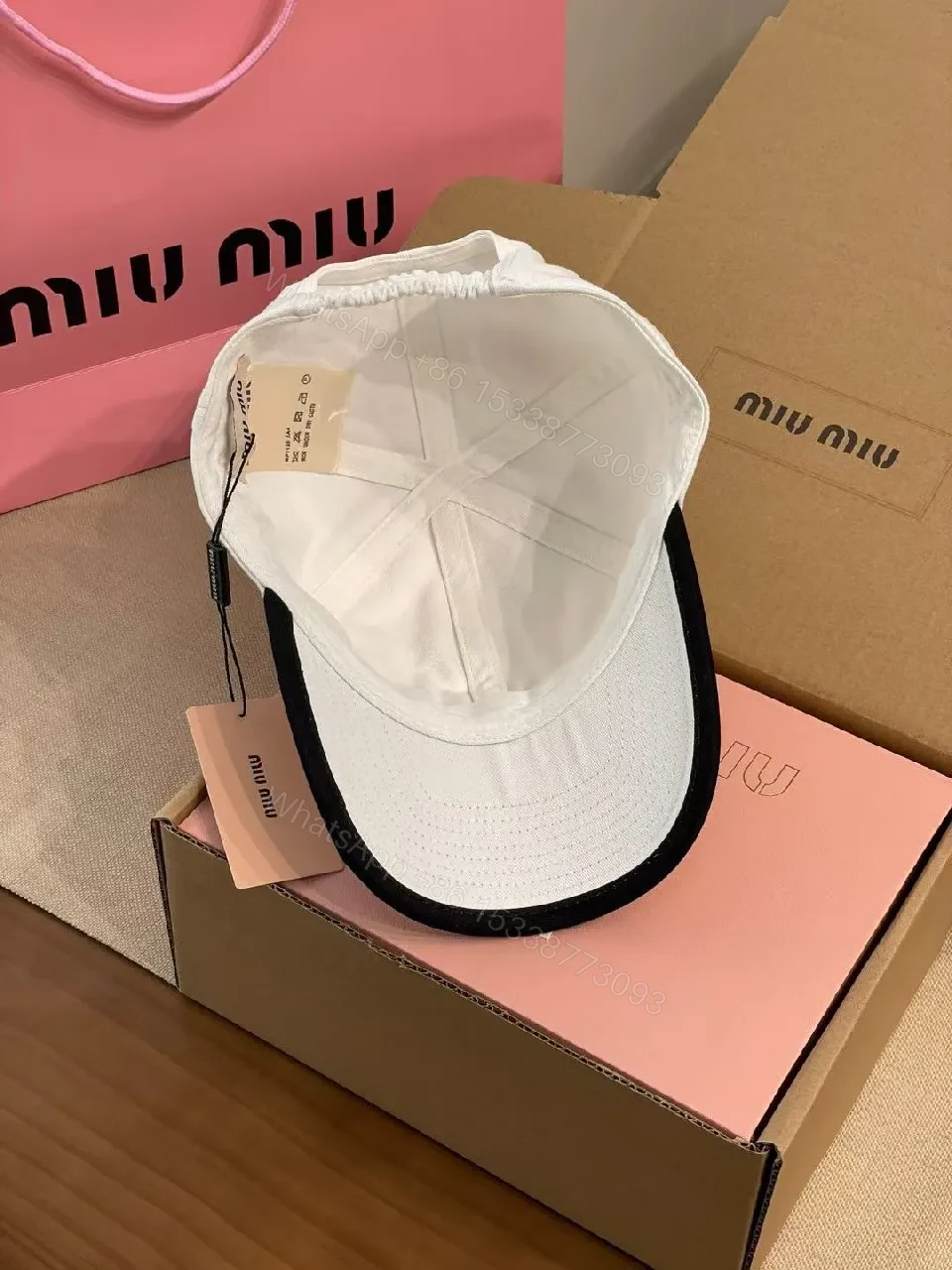 View 7 of White Cotton Cap | Structured Six-Panel, Logo Detail, Adjustable Fit