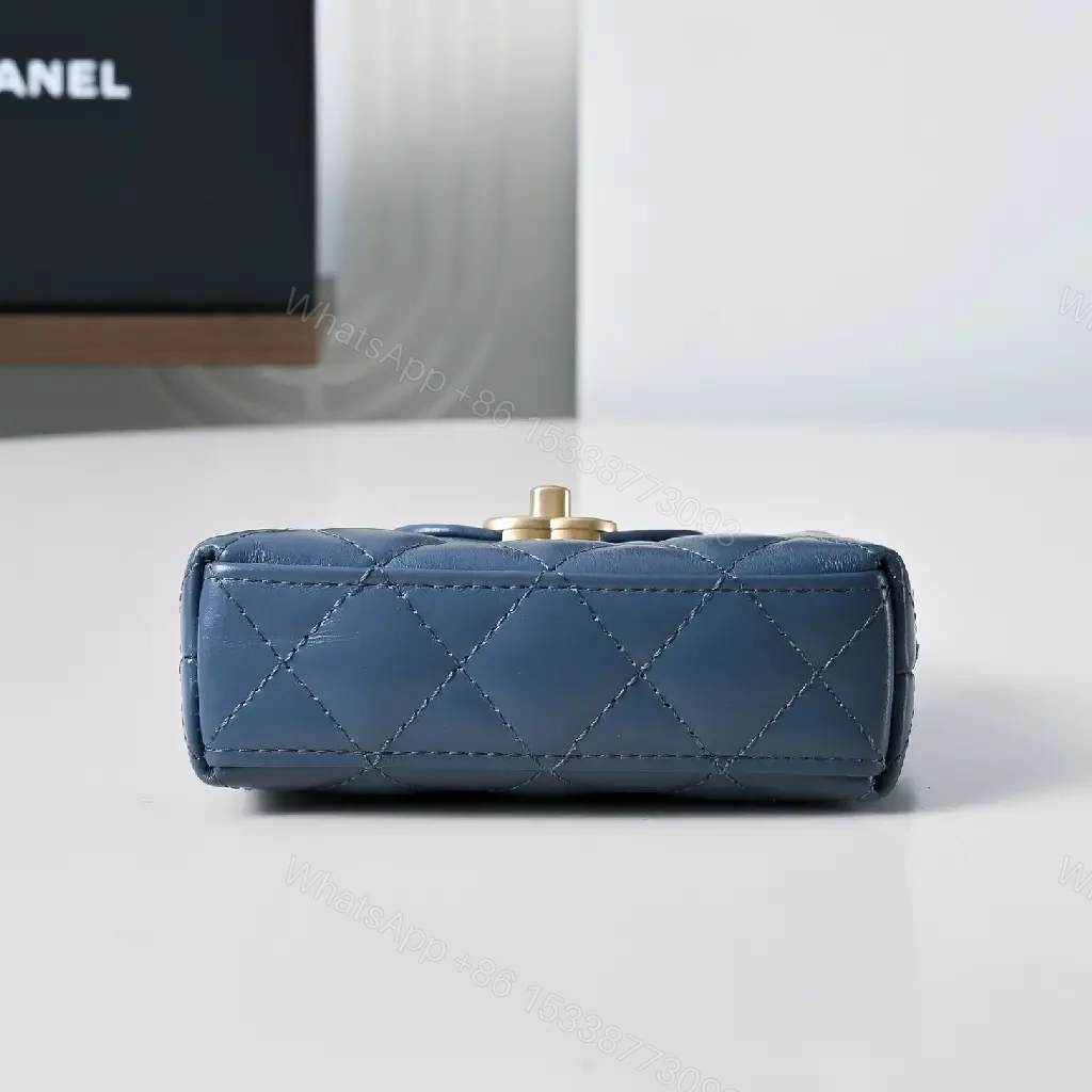 View 5 of Compact Blue Quilted Satchel with Gold Clasp Bag