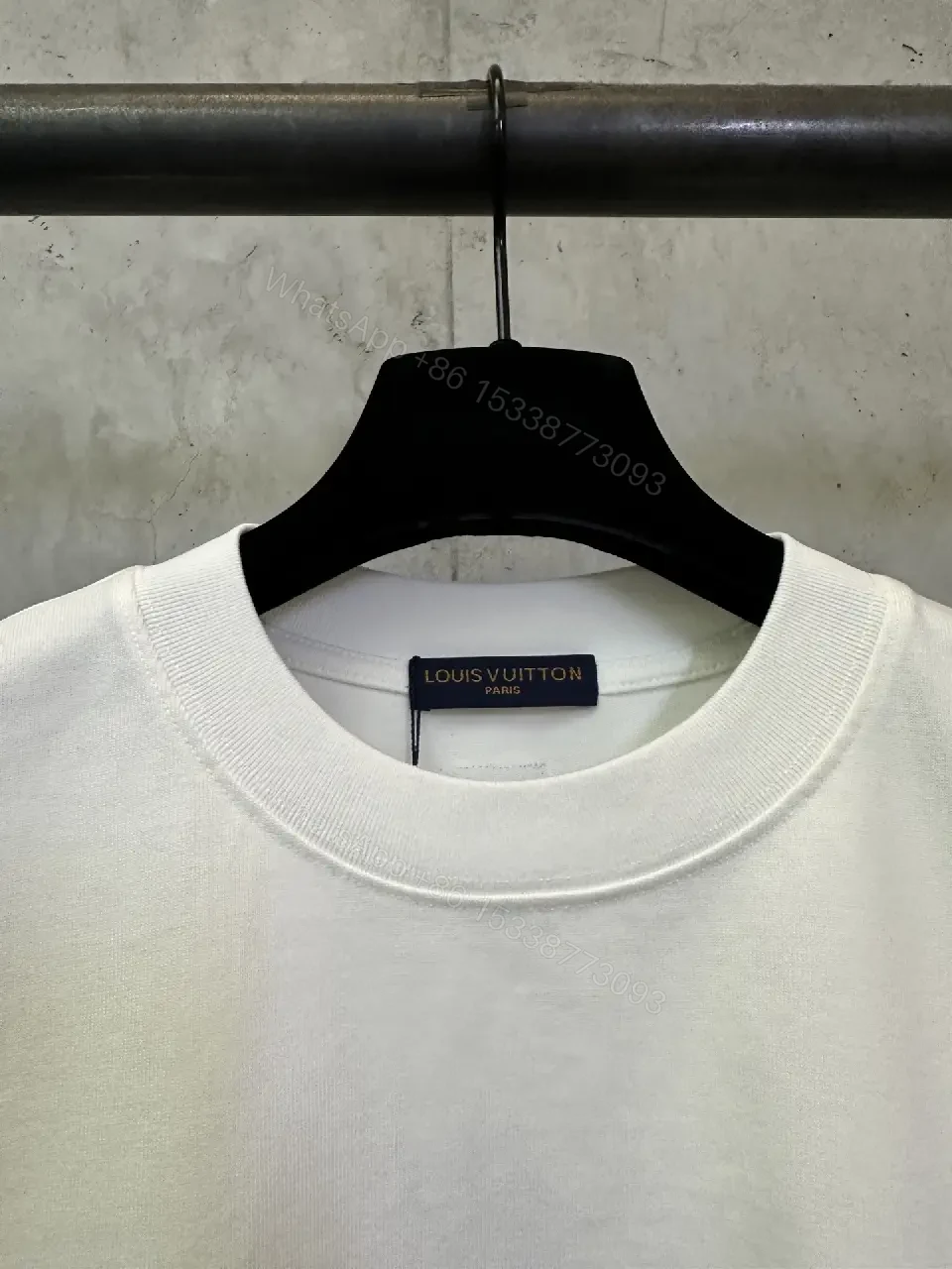 View 8 of Minimalist White Tee with Subtle LV.M. Marking — Premium Everyday Wear