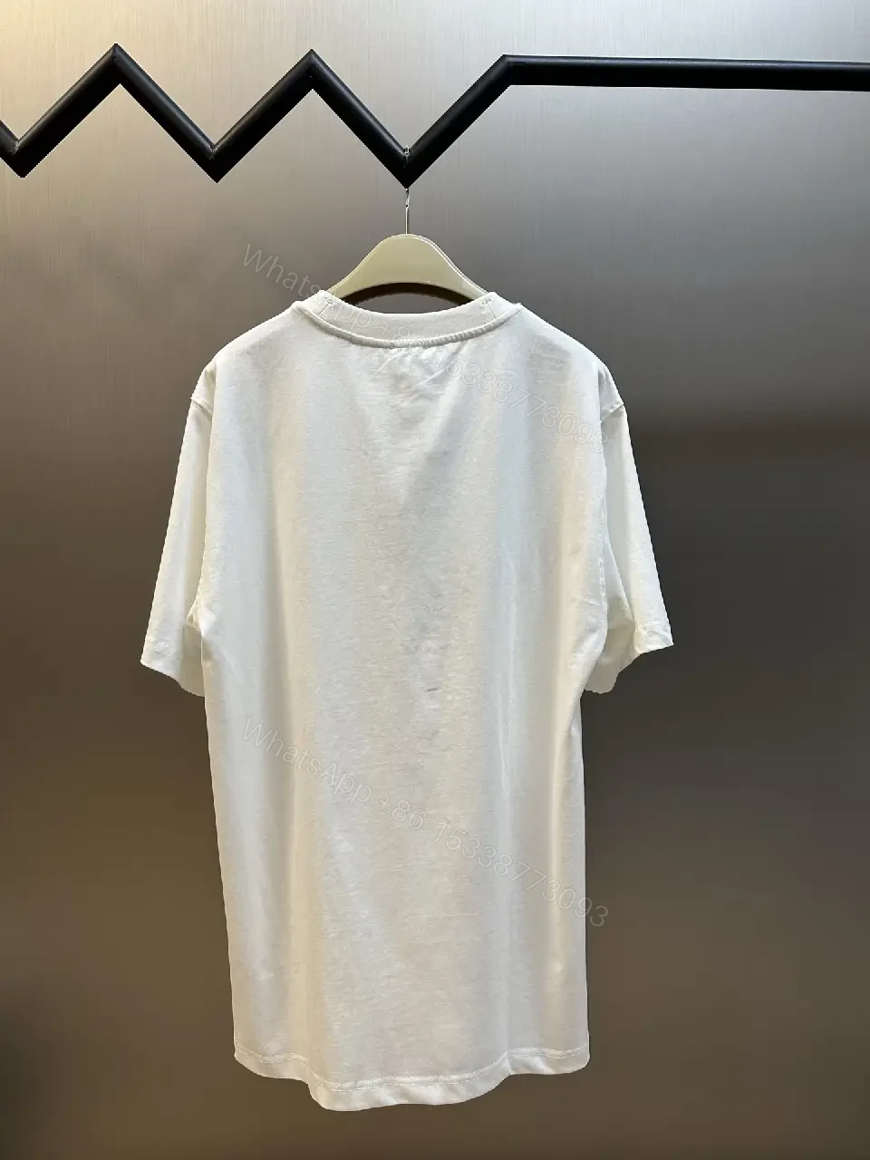 View 8 of Minimalist Burberry-Style White Cotton Tee: Elevated Everyday Comfort