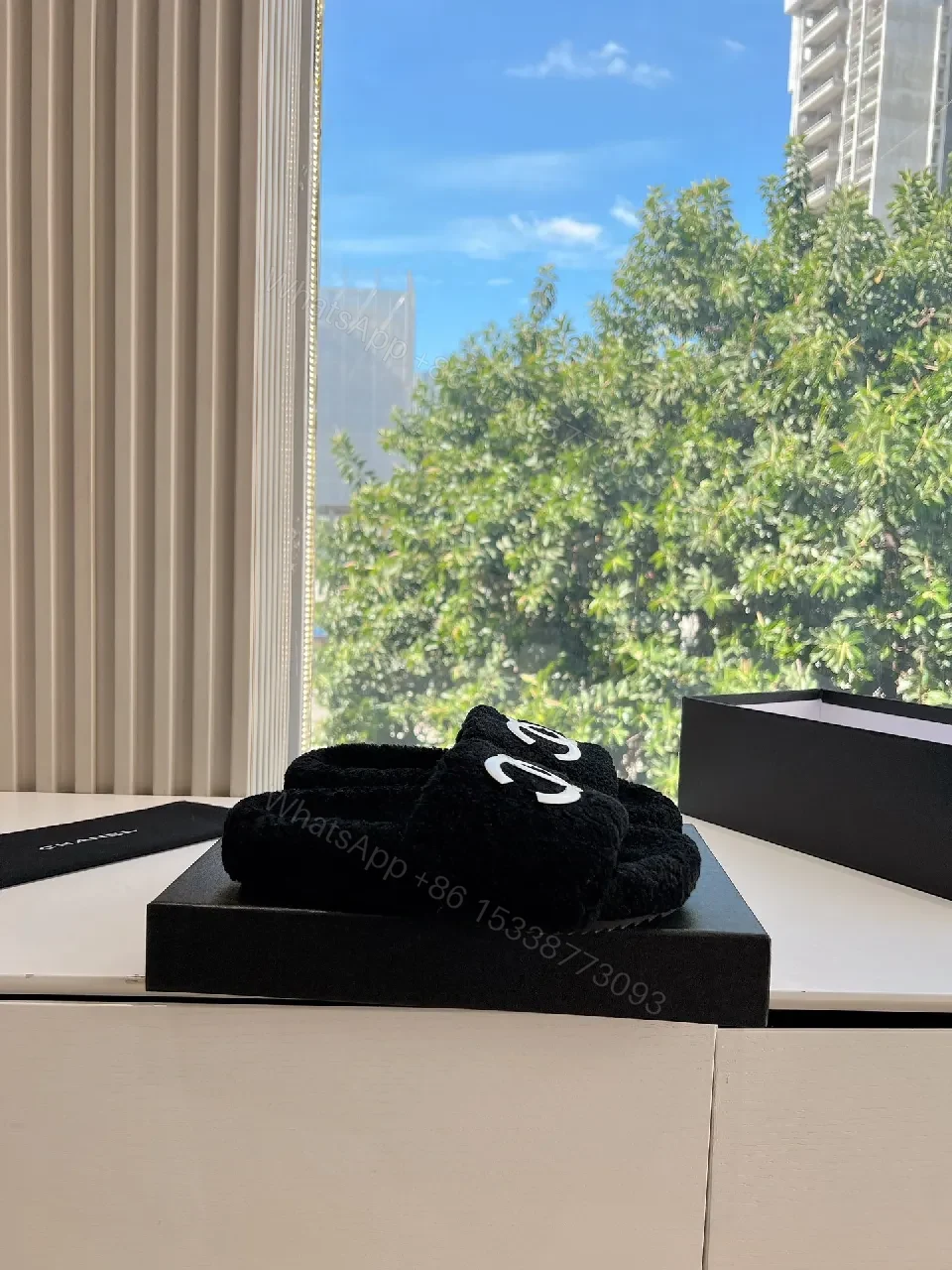 View 5 of Cozy Black Plush Slippers with Logo Detail