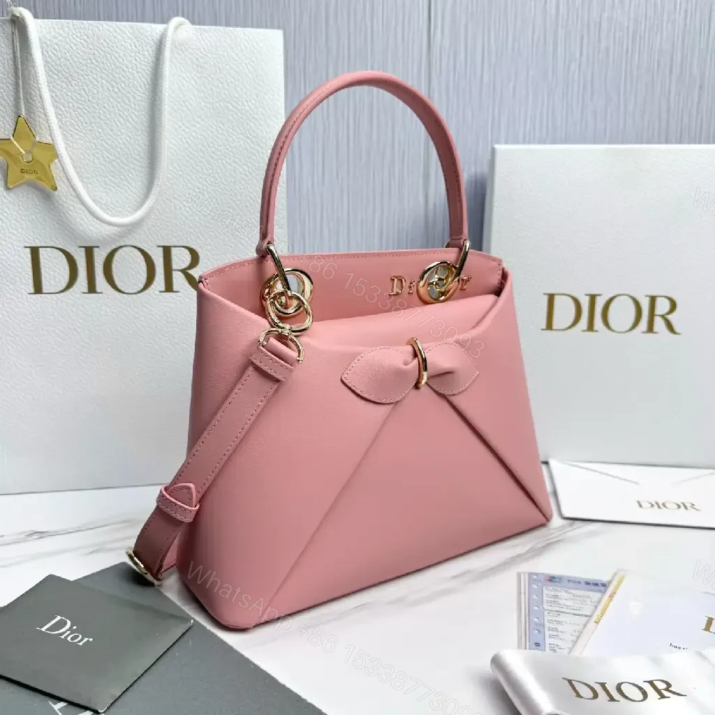 View 6 of Soft Pink Faux-Leather Satchel: Bow Accent, Sculpted Diagonal Panels, Crossbody Comfort
