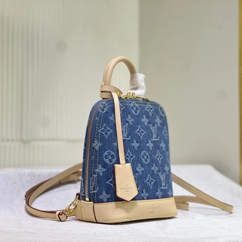 View 3 of Louis Vuitton Alma Backpack Blue Denim 20Cm