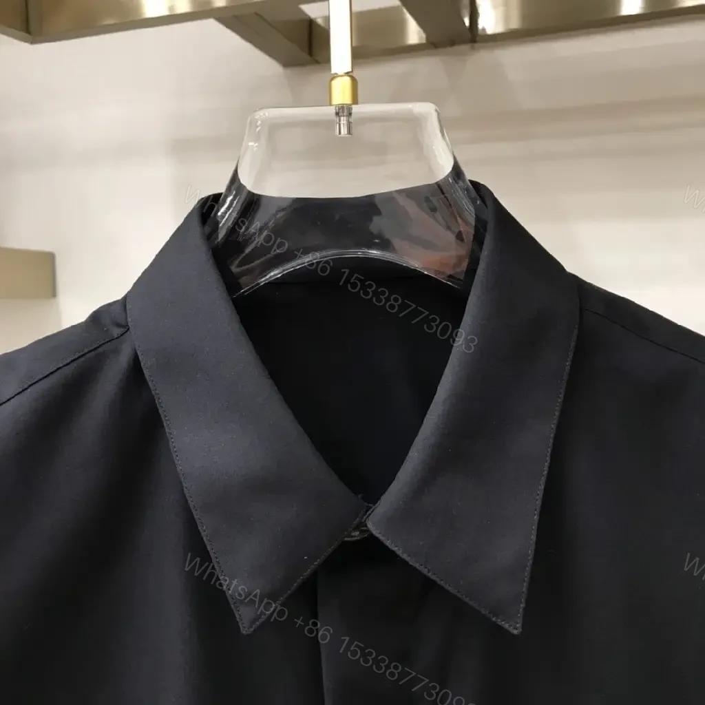 View 5 of Minimal Black Shirt Jacket with Subtle Logo Button Front