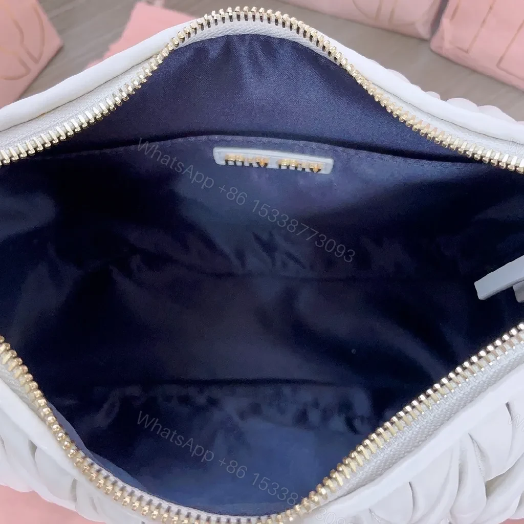 View 8 of Pearl White Quilted Handbag – Soft Gold Logo, Elegant Wave Stitching