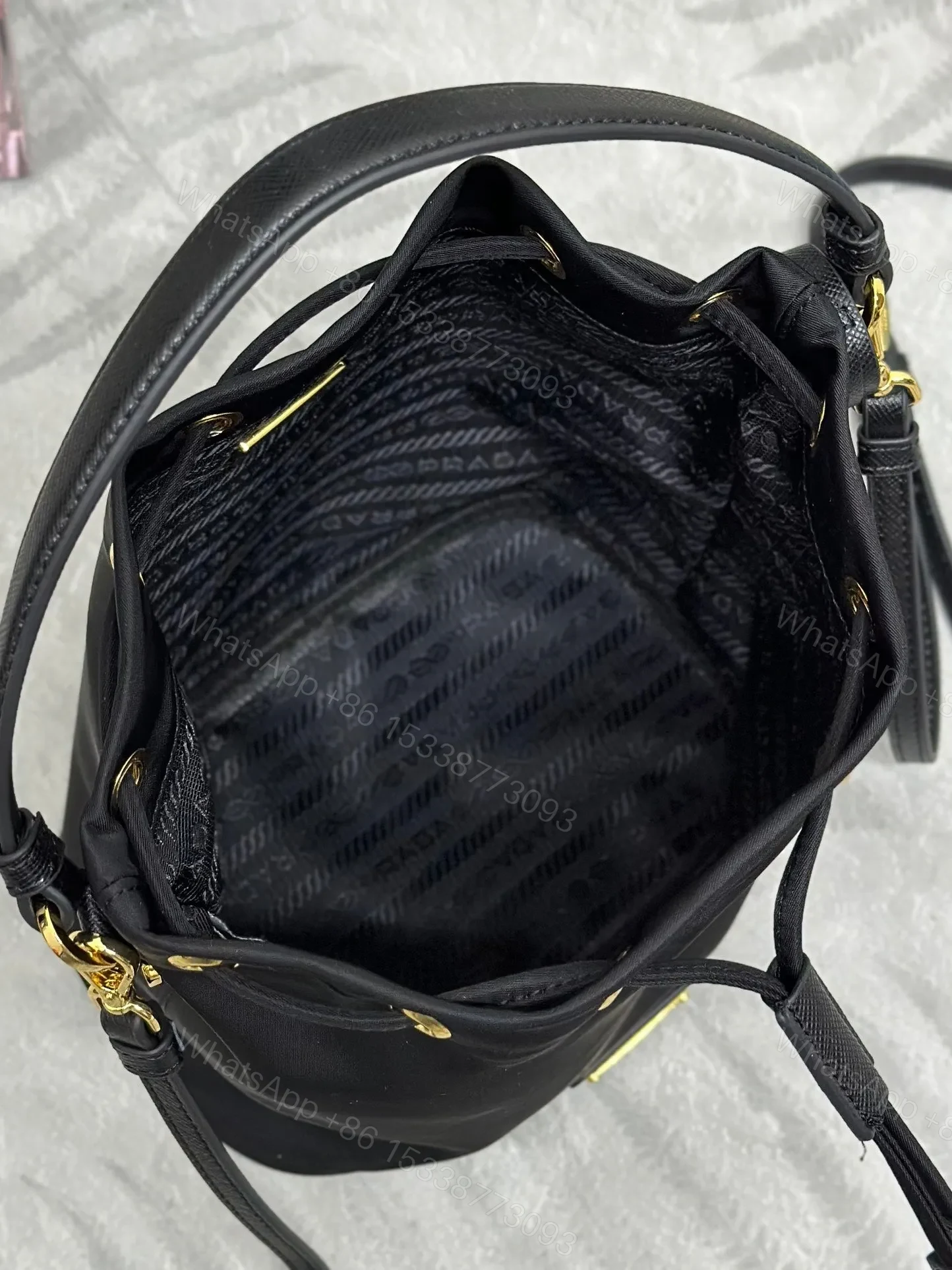 View 3 of BUCKET BAG 19 IN BLACK RE-NYLON AND CALFSKIN HANDLE