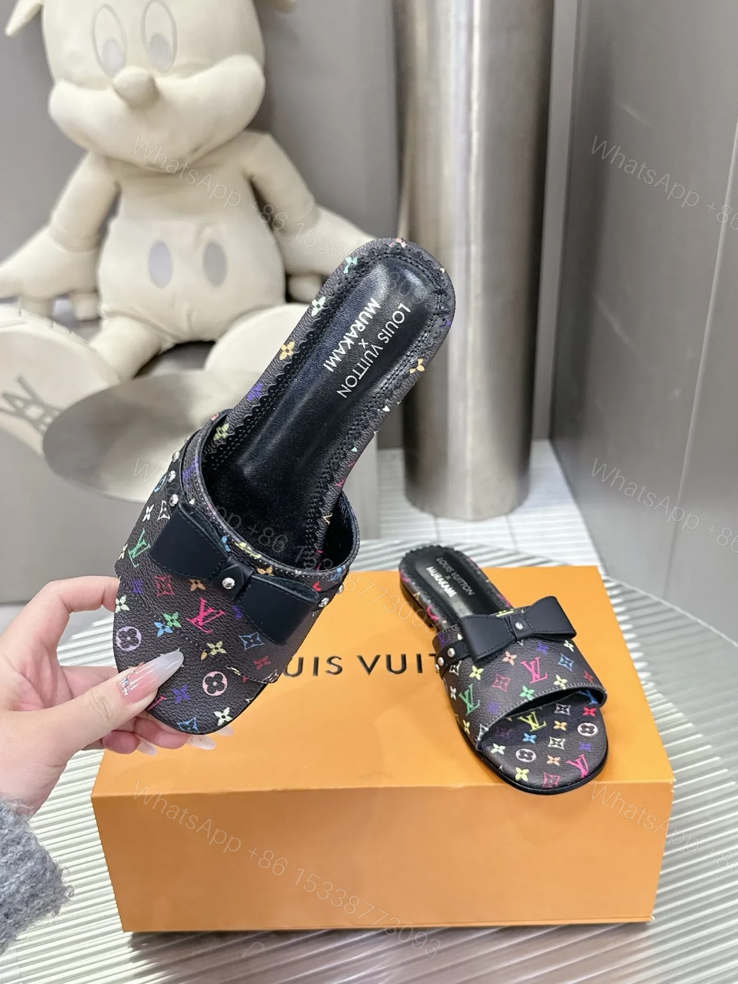View 4 of LV Women Black Patterned Leather Bow Slide Sandals